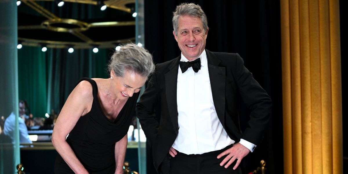 Ooof, Hugh Grant’s Awkward Red Carpet Interview Is A Hard Watch Gold